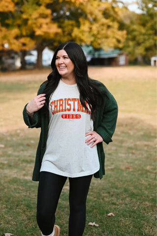 Model wearing a festive tee from Tucked & Threaded | Greenfield, TN