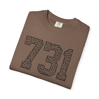 Folded brown t-shirt with leopard print numbers '731' on a white background