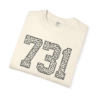 Folded beige sweatshirt with '731' printed in black leopard print design on a white background