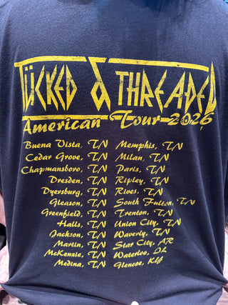 Black t-shirt with yellow text and graphics, featuring a tour schedule and 'Vikings' branding.