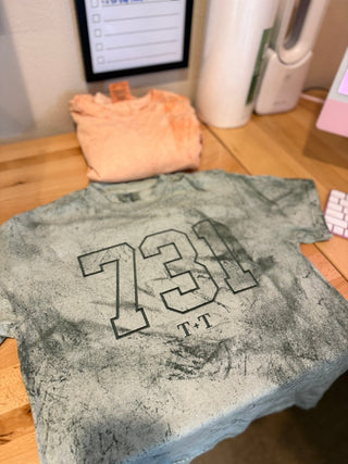 731 Area Code Colorblast Green Unisex Tee - Tucked & Threaded