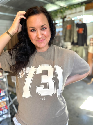 a 731 area code tee in taupe brown color worn by female model