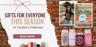 Promotional banner for Tucked & Threaded with products and text that says 'Gifts for everyone this season at Tucked & Threaded" on a brick background. | Greenfield, TN