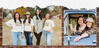 Two women in a car with a scenic background, one of them wearing a 'Winnie the Pooh' shirt.