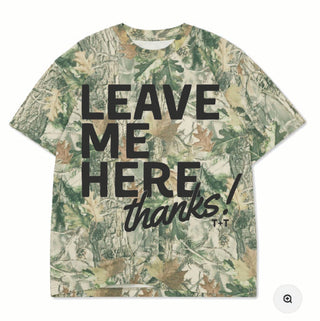 camouflage graphic tee for southern ladies that has a design reading "leave me here, thanks!" in black ink