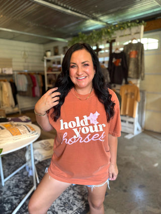 graphic tee that reads hold your horses on female model