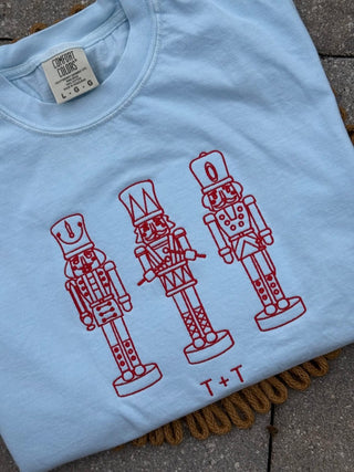 Nutcracker Trio Embroidered Sky Blue Unisex Tee - Tucked & Threaded