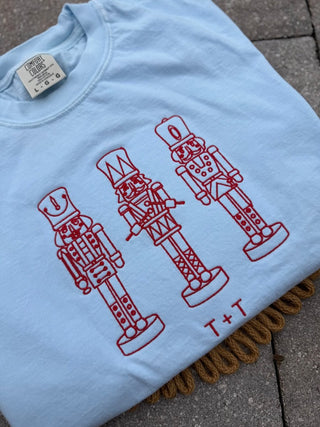 Nutcracker Trio Embroidered Sky Blue Unisex Tee - Tucked & Threaded
